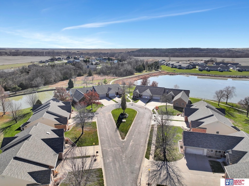 drone / aerial view with a water view