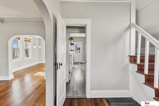 interior space featuring wood-type flooring and a textured ceiling