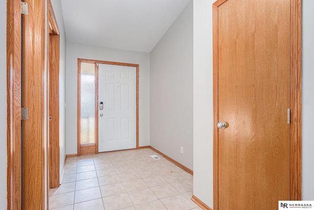 entryway featuring light tile patterned flooring