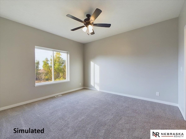 empty room with carpet flooring and ceiling fan