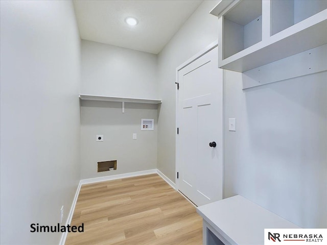 laundry room featuring hardwood / wood-style flooring, electric dryer hookup, and hookup for a washing machine