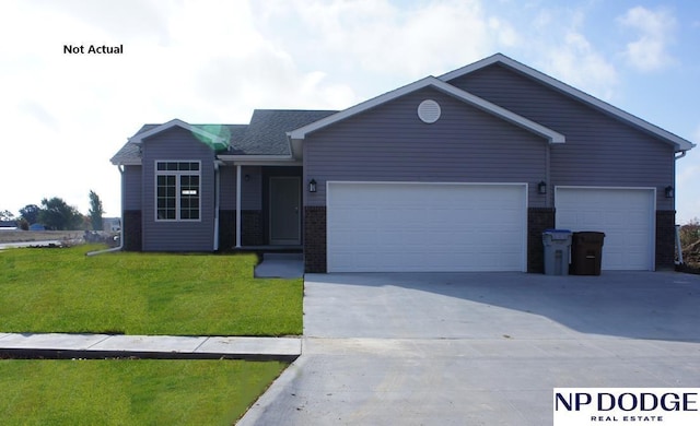 ranch-style home featuring a garage and a front yard