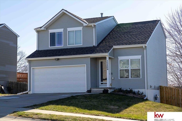 view of property with a front yard and a garage