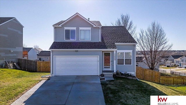 view of property featuring a garage and a front yard