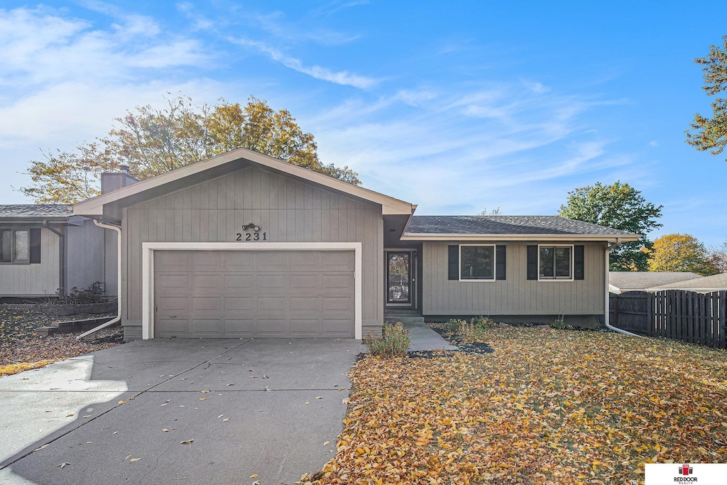 single story home featuring a garage