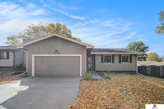 single story home featuring a garage