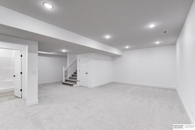 basement with light colored carpet