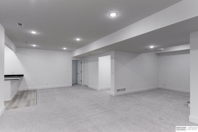 basement with light carpet