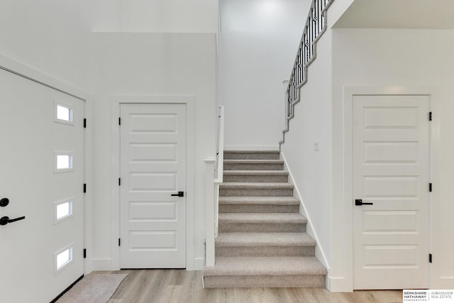 entryway featuring light wood-type flooring and a wealth of natural light