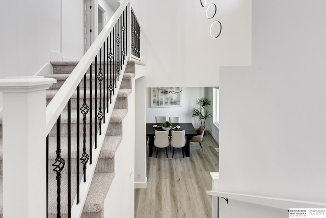 stairs with hardwood / wood-style flooring