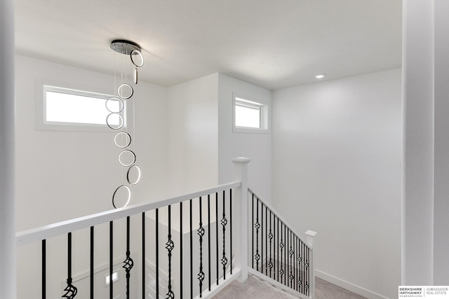 staircase with carpet flooring and plenty of natural light