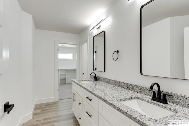 bathroom featuring hardwood / wood-style floors and vanity