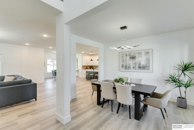 dining area with light wood-type flooring