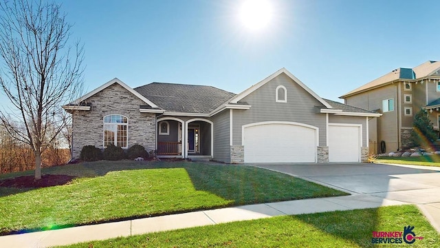 view of front of house with a garage and a front yard