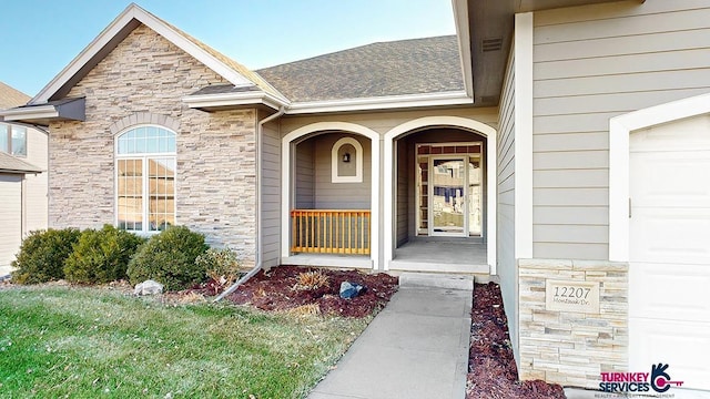 doorway to property with a porch