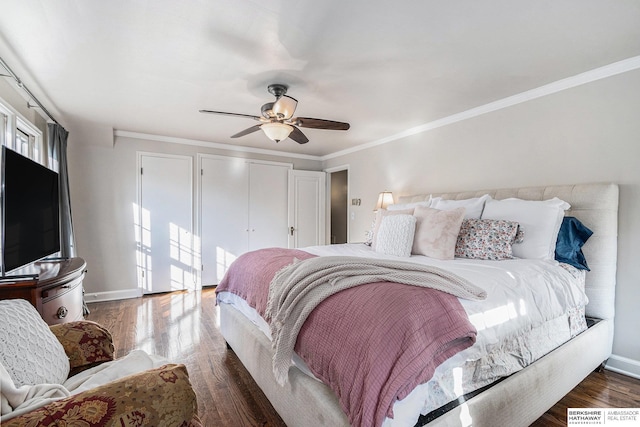 bedroom featuring a closet, dark hardwood / wood-style floors, ceiling fan, and ornamental molding