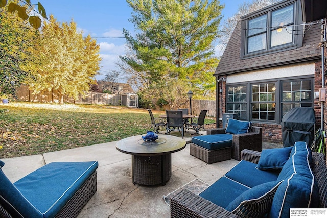 view of patio / terrace with an outdoor living space and a storage unit