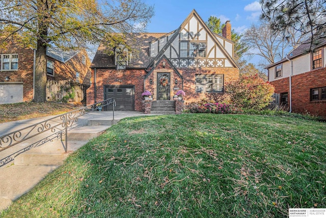 tudor-style house with a garage and a front lawn