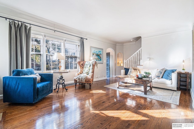 living room with crown molding and hardwood / wood-style floors