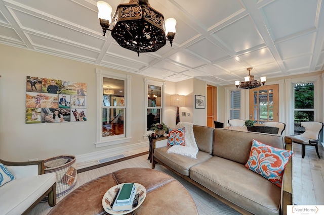 living room featuring a chandelier, wood-type flooring, and coffered ceiling