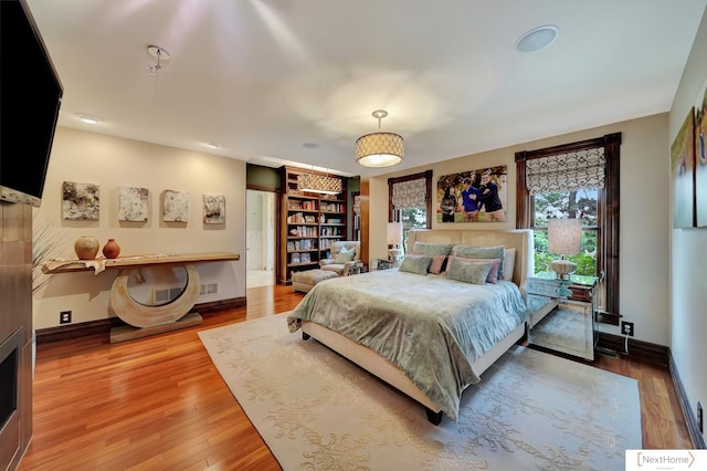 bedroom with hardwood / wood-style flooring