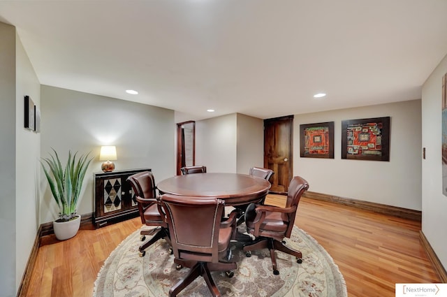 dining area with light hardwood / wood-style floors