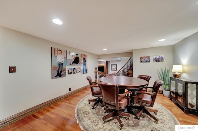 dining space with light hardwood / wood-style flooring