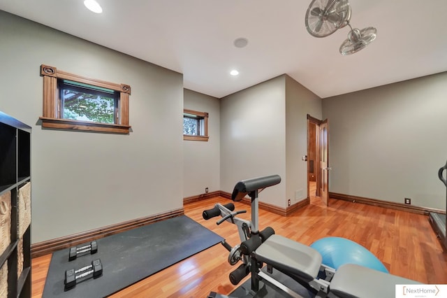 exercise area with light hardwood / wood-style flooring