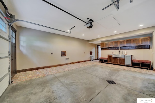 garage with sink and a garage door opener