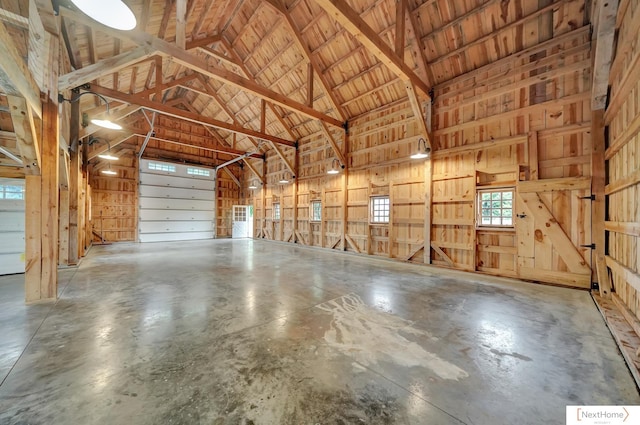 garage featuring wooden walls