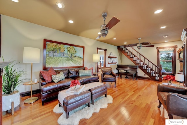 living room with hardwood / wood-style flooring and ceiling fan