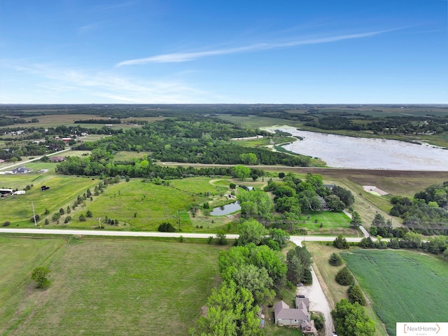 birds eye view of property with a rural view and a water view