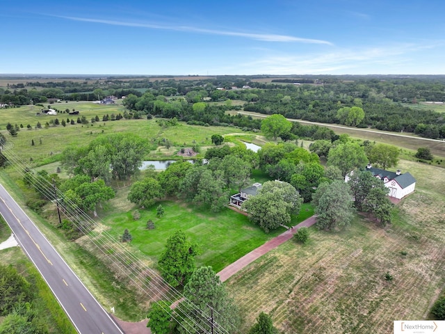 drone / aerial view with a rural view and a water view