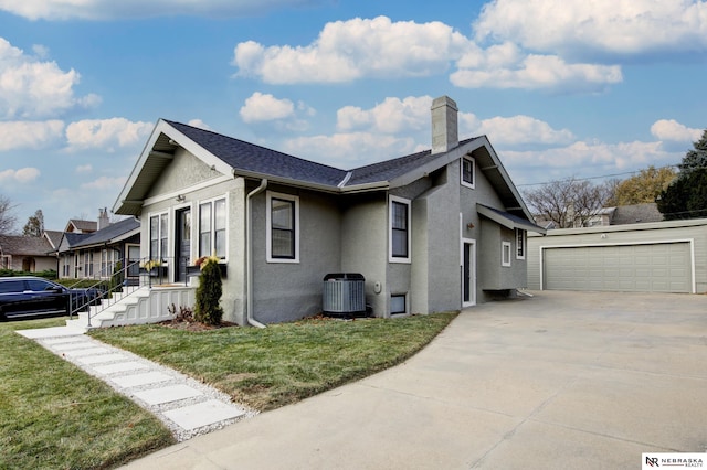 view of property exterior with a garage, a lawn, and central air condition unit