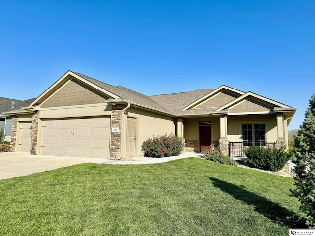 craftsman-style home featuring a porch, a garage, and a front lawn