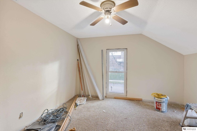 bonus room featuring light carpet, ceiling fan, and vaulted ceiling