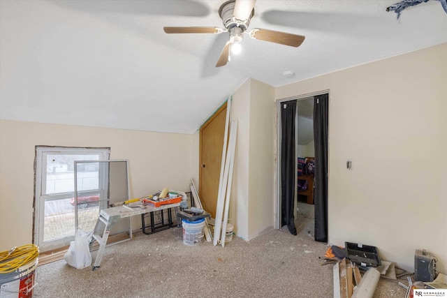 game room featuring a textured ceiling, ceiling fan, light colored carpet, and vaulted ceiling