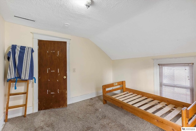 bonus room featuring carpet flooring, a textured ceiling, and lofted ceiling