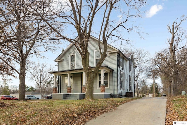 view of front of property featuring covered porch and central air condition unit