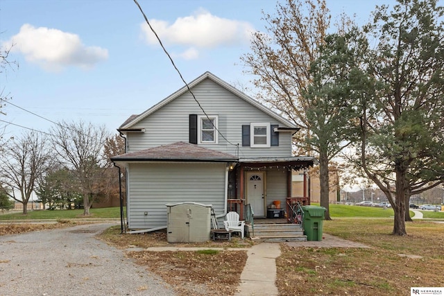 bungalow-style home with a front lawn