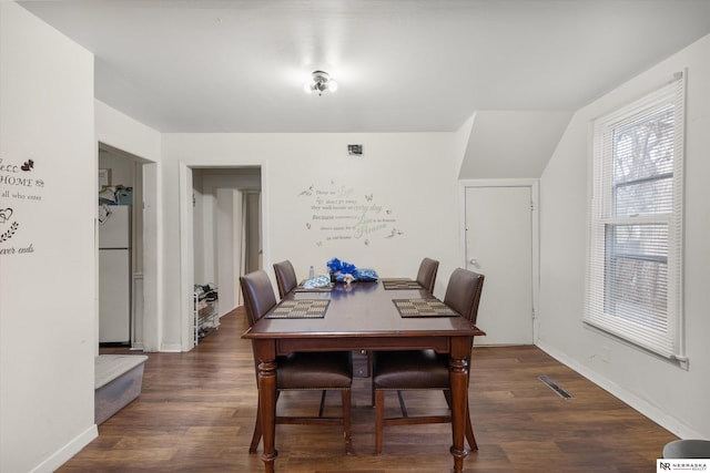 dining area featuring dark hardwood / wood-style floors