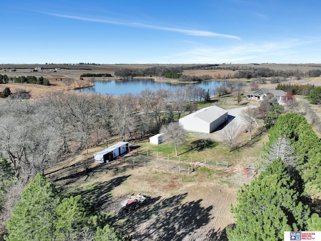 birds eye view of property with a rural view and a water view