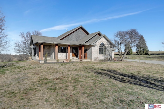 view of front of property with a front yard and a porch