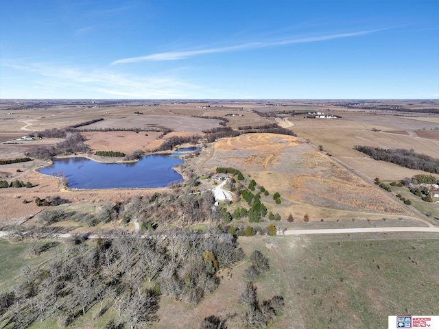 birds eye view of property with a rural view and a water view