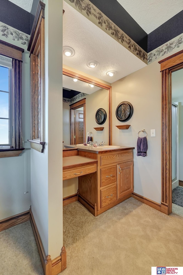 bathroom featuring vanity and a textured ceiling