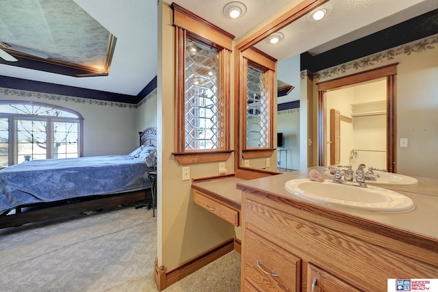 bathroom with vanity and a textured ceiling