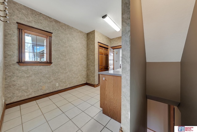 corridor featuring light tile patterned flooring