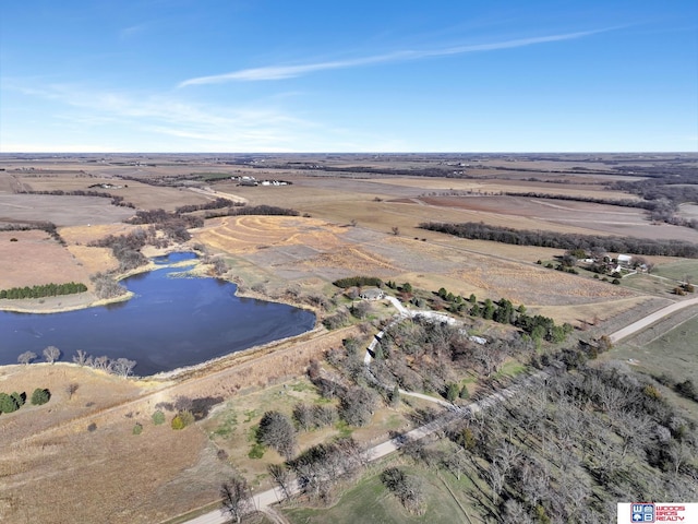 drone / aerial view featuring a water view and a rural view