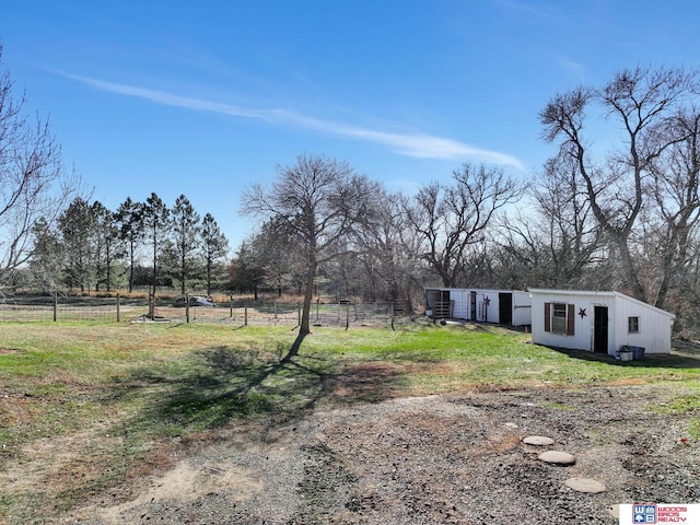 view of yard with a rural view