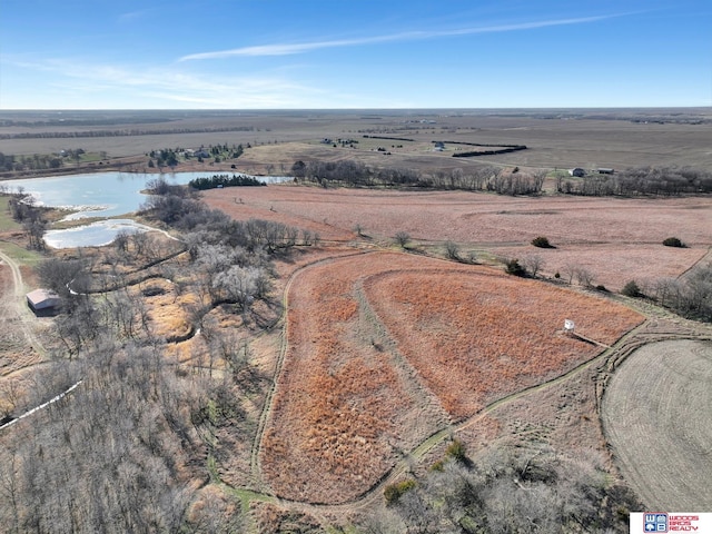 aerial view featuring a rural view and a water view